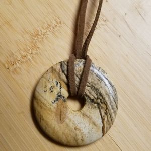 Vintage Jasper Pi Stone necklace on brown leather cord.